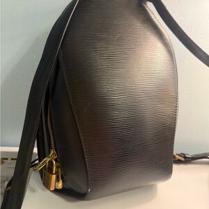 Louis Vuitton Black Leather Backpack with Gold Accents